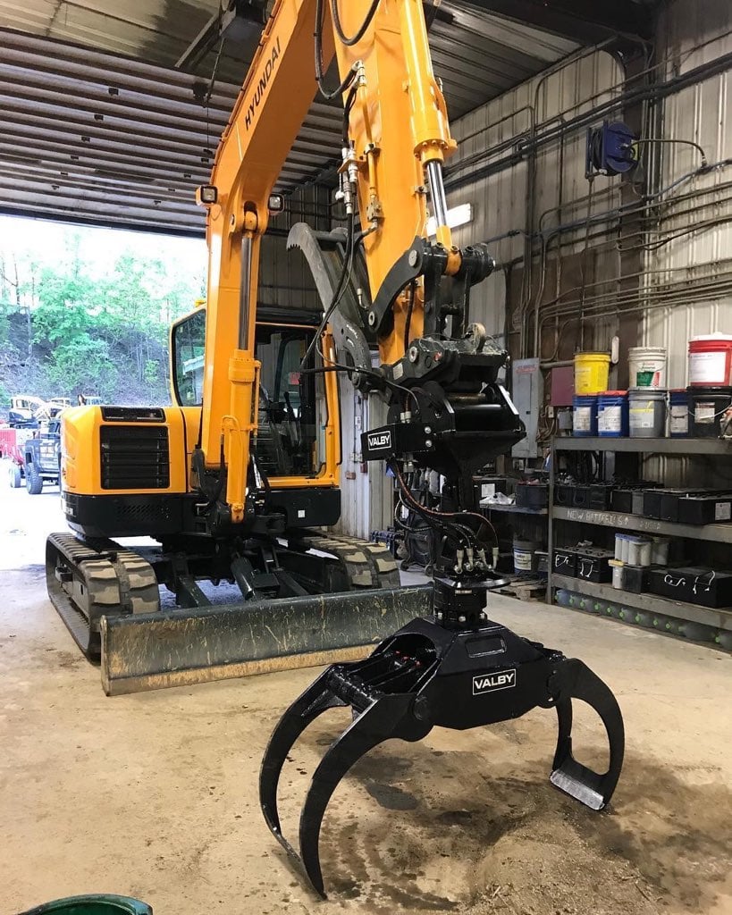 Mini excavator with grapple